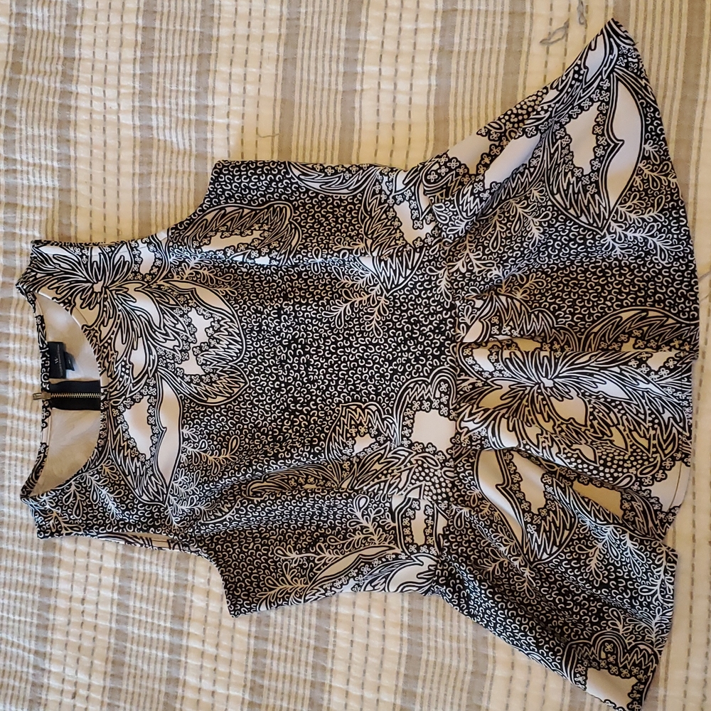 Black and white peplum blouse